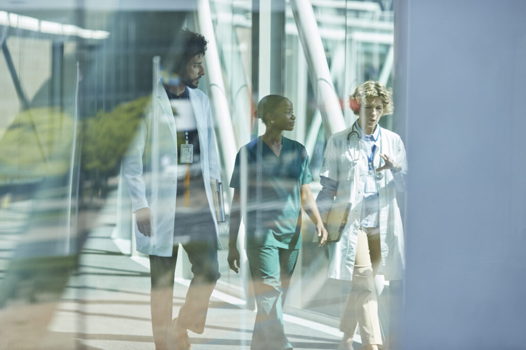 Healthcare leadership team walking together in conversation